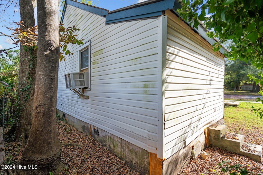 view of side of property with cooling unit