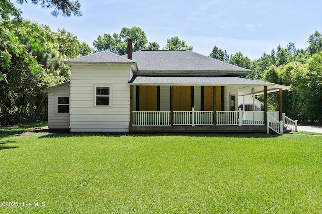 401 Pecan Ln, Lake Waccamaw, NC 28450 - rear view of property with a porch, a yard, and a shingled roof