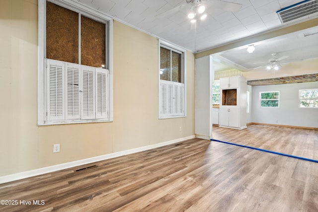 401 Pecan Ln, Lake Waccamaw, NC 28450 - empty room with a ceiling fan, wood finished floors, and ornamental molding