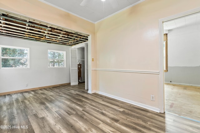 401 Pecan Ln, Lake Waccamaw, NC 28450 - unfurnished room featuring wood finished floors, ornamental molding, and a ceiling fan