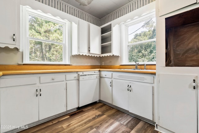 401 Pecan Ln, Lake Waccamaw, NC 28450 - kitchen with white dishwasher, white cabinets, light countertops, and plenty of natural light