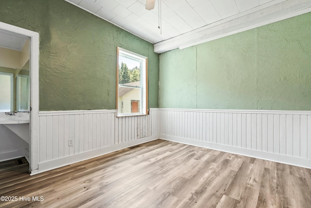 401 Pecan Ln, Lake Waccamaw, NC 28450 - empty room with a textured wall and wood finished floors