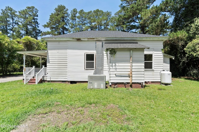 401 Pecan Ln, Lake Waccamaw, NC 28450 - view of side of home with a yard, roof with shingles, and crawl space