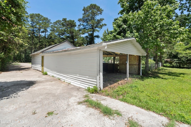 401 Pecan Ln, Lake Waccamaw, NC 28450 - garage with a detached carport