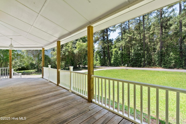 401 Pecan Ln, Lake Waccamaw, NC 28450 - wooden terrace with a yard and view of wooded area