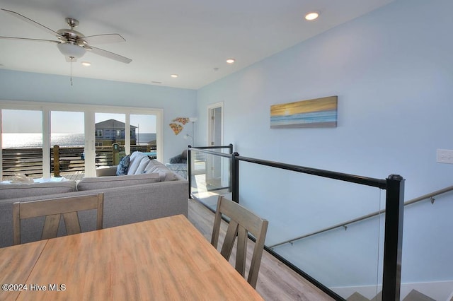 dining area with ceiling fan and light hardwood / wood-style flooring