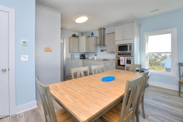 dining room with light wood-type flooring