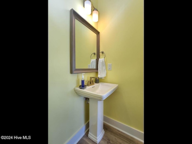 bathroom featuring hardwood / wood-style floors and sink