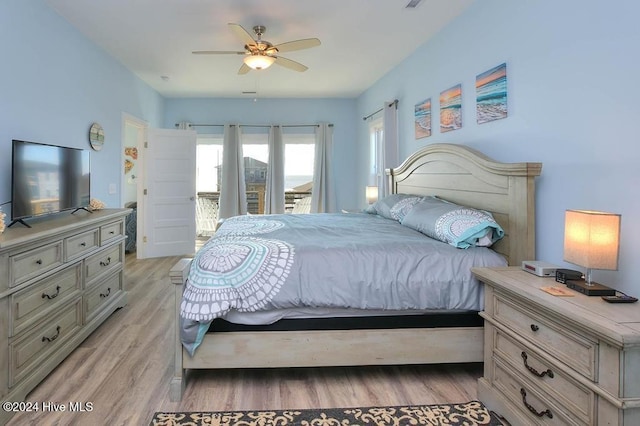 bedroom with access to outside, ceiling fan, and light wood-type flooring