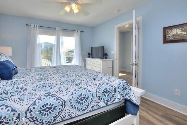 bedroom with ceiling fan and light wood-type flooring