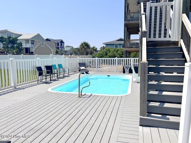 view of pool with a deck