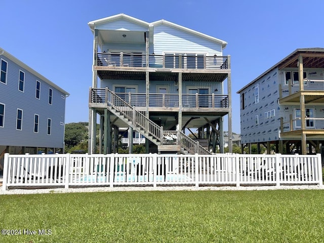 rear view of house with a yard