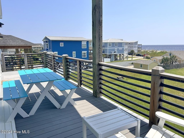 wooden deck with a water view