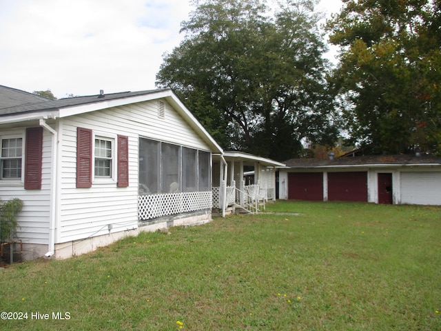 view of side of home featuring a lawn