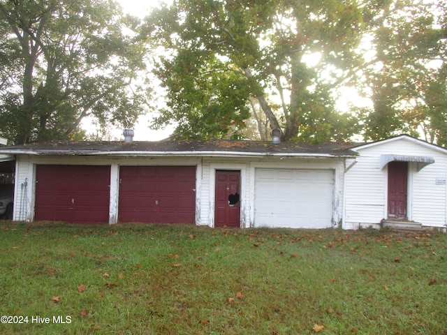 garage featuring a yard