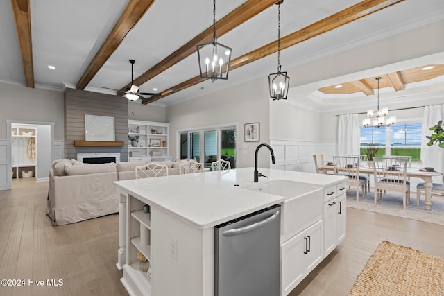 kitchen with dishwasher, a center island with sink, white cabinets, decorative light fixtures, and light hardwood / wood-style floors