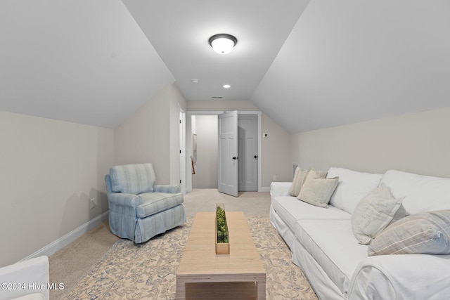 living room featuring light colored carpet and lofted ceiling