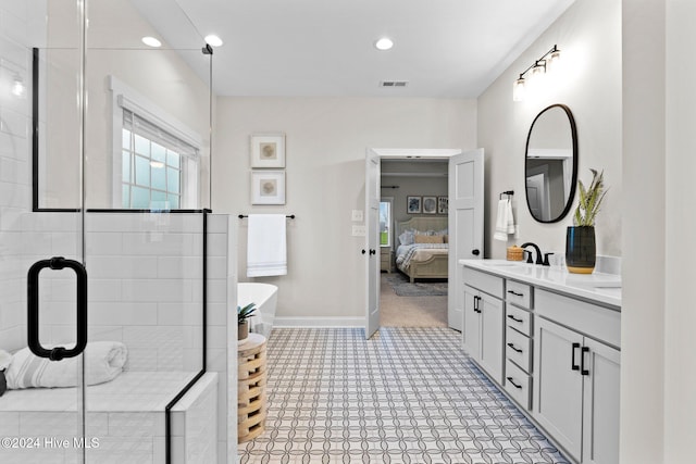 bathroom featuring vanity and a shower with door