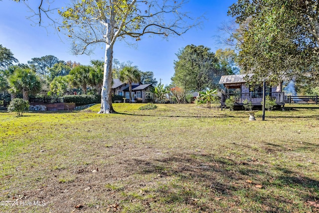 view of yard featuring a wooden deck