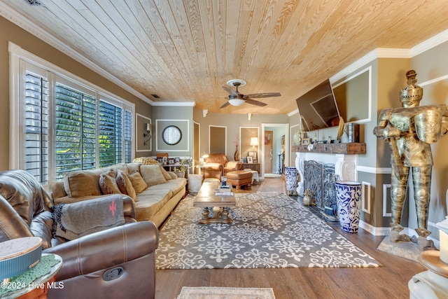 living room featuring ceiling fan, hardwood / wood-style floors, wooden ceiling, and ornamental molding