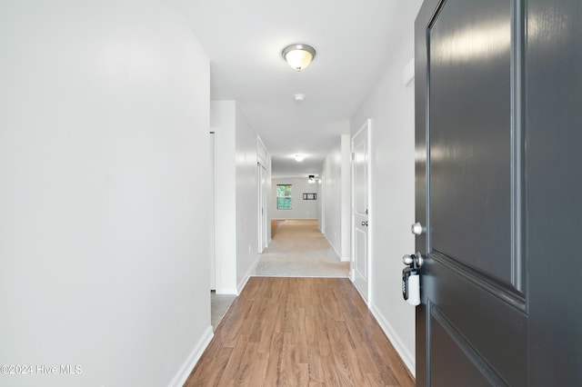 corridor featuring light hardwood / wood-style flooring