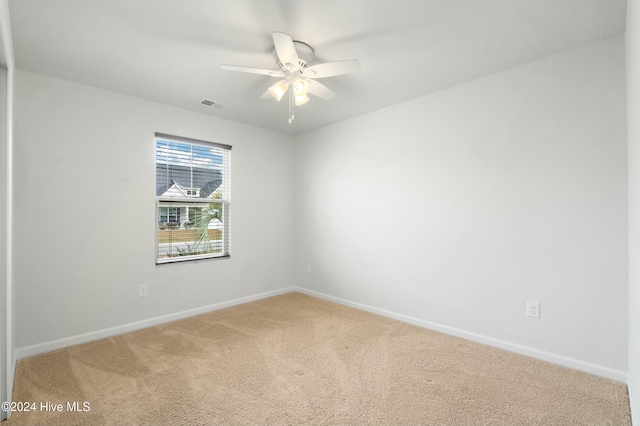 empty room with carpet and ceiling fan