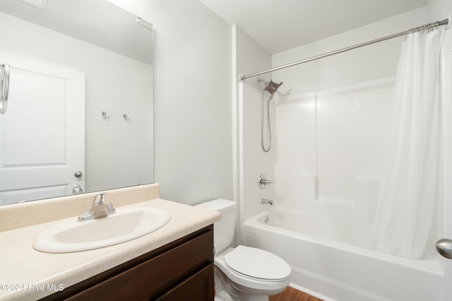 full bathroom with vanity, shower / bath combination with curtain, and toilet