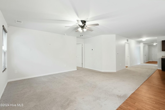 unfurnished room featuring ceiling fan and light hardwood / wood-style flooring