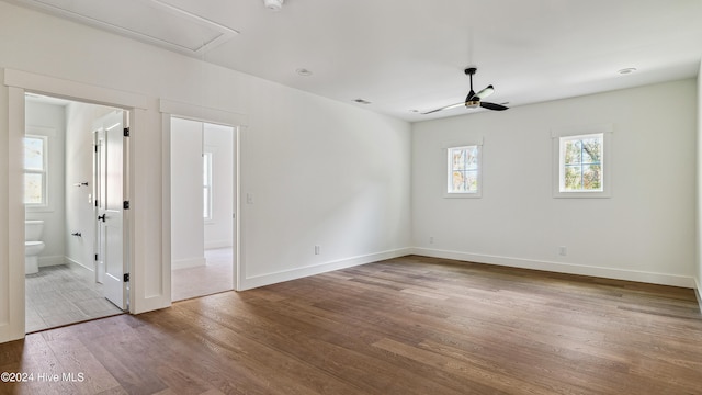 unfurnished room with hardwood / wood-style flooring and ceiling fan