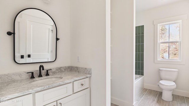 full bathroom with vanity, toilet, and bathing tub / shower combination