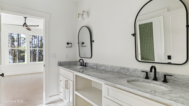 bathroom featuring ceiling fan and vanity