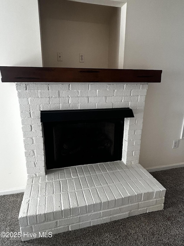 details featuring carpet and a fireplace