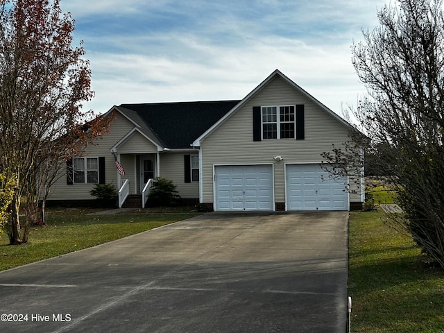 view of front facade with a garage and a front yard