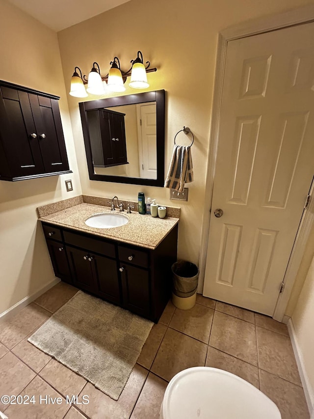 bathroom with tile patterned flooring and vanity