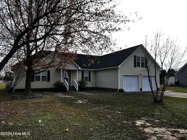 view of front facade with a garage and a front lawn