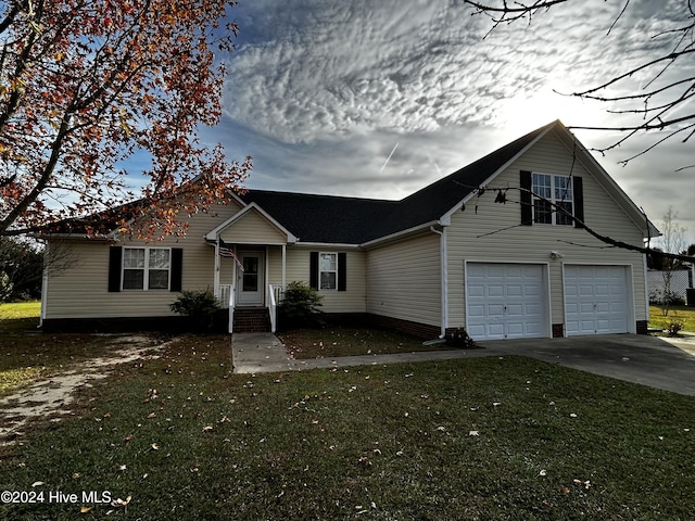 view of front facade featuring a garage and a front yard