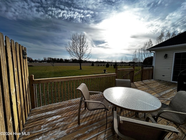 wooden terrace with a yard