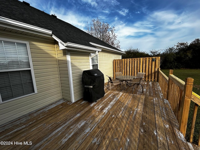 deck featuring a grill