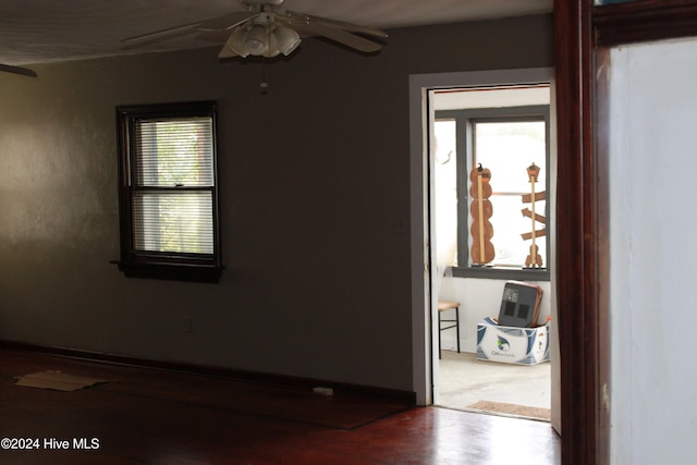 unfurnished room with ceiling fan and hardwood / wood-style floors