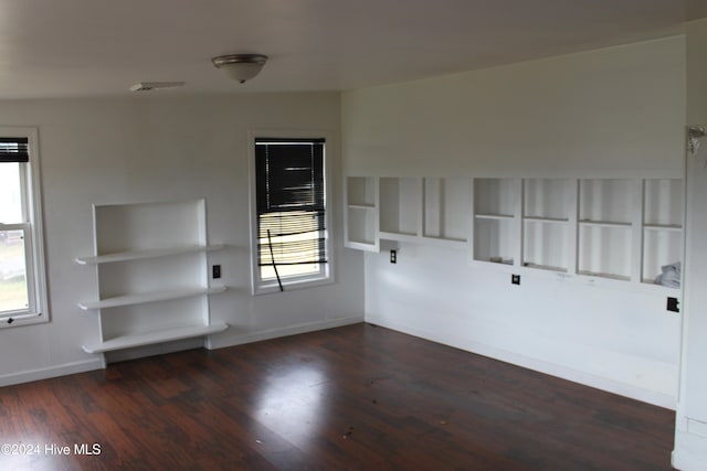 unfurnished room featuring dark hardwood / wood-style floors