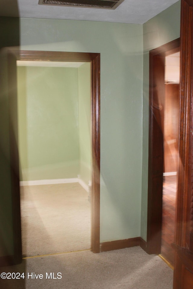 hallway featuring carpet floors