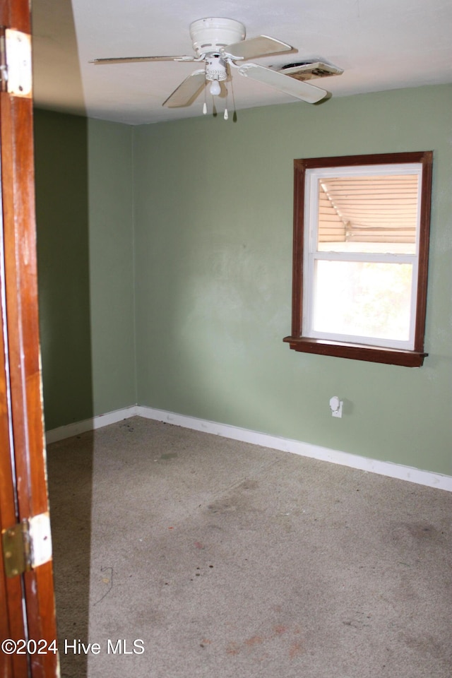 unfurnished room featuring carpet