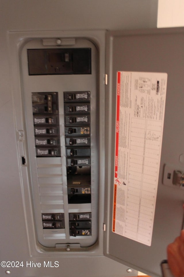 utility room featuring electric panel