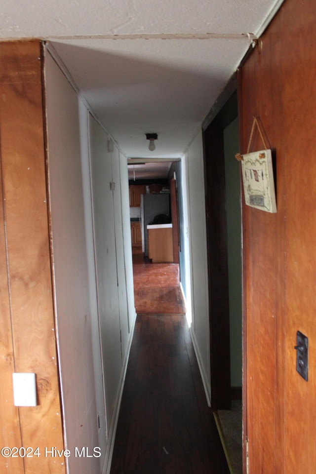 hall with dark hardwood / wood-style flooring