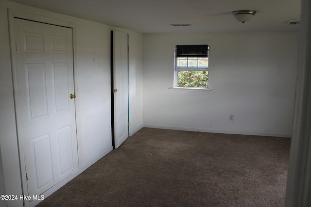 unfurnished bedroom featuring carpet