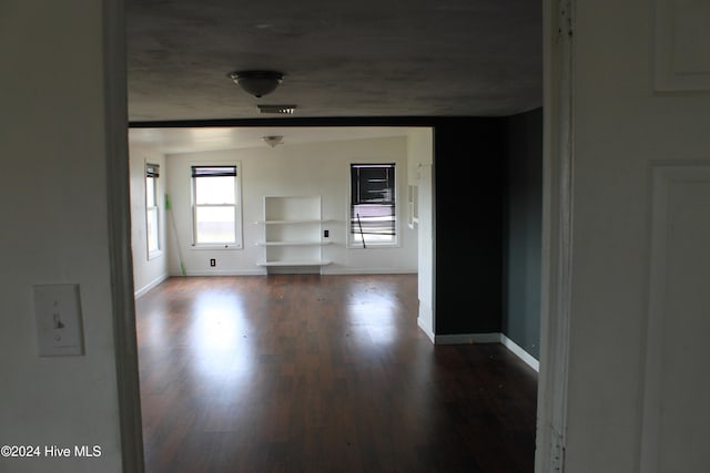 interior space with dark hardwood / wood-style flooring