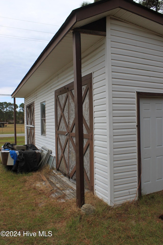 view of side of home with an outbuilding