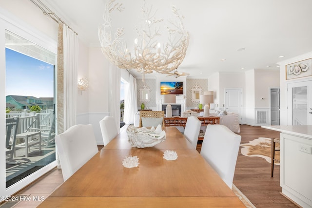 kitchen with white cabinetry, sink, light hardwood / wood-style floors, white appliances, and custom exhaust hood