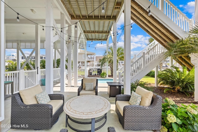 wooden deck featuring a water view