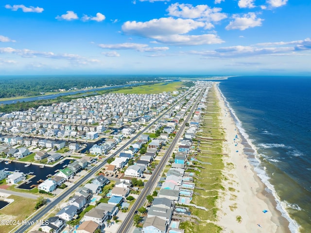 bird's eye view featuring a water view and a view of the beach